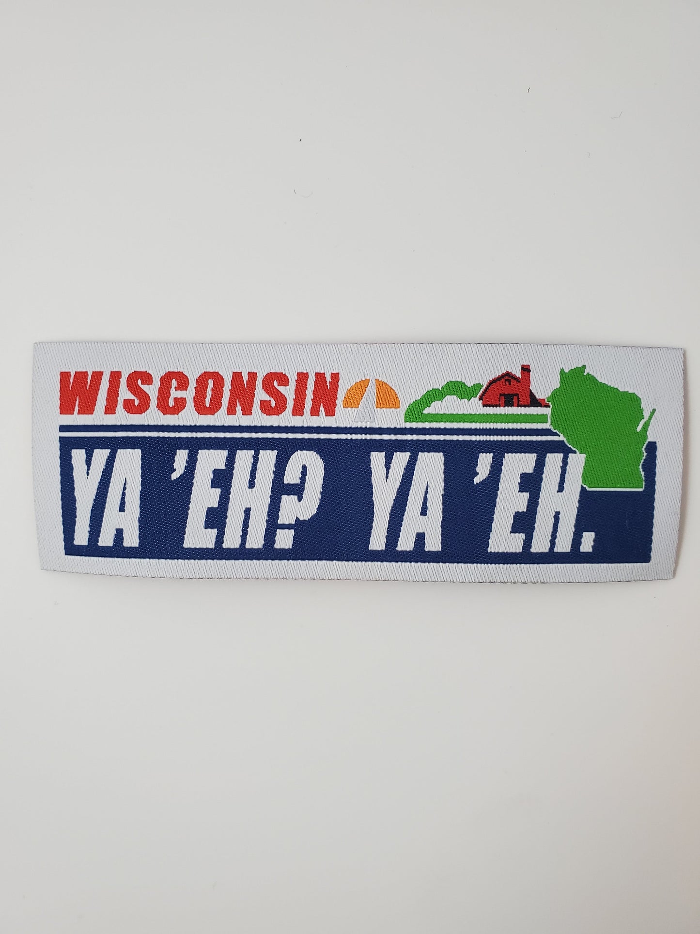 "Ya 'Eh? Ya 'Eh." Wisconsin Plate Design Trucker Hat (Black Mesh/ Heather Grey Fabric)