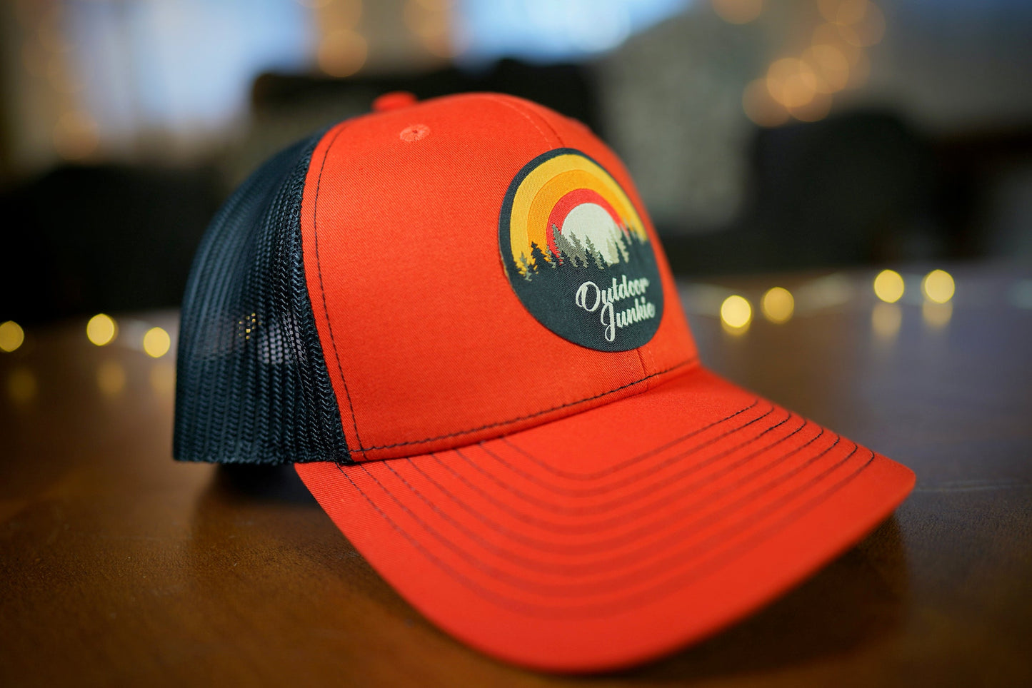 "Outdoor Junkie" Design Trucker Hat (Black Mesh/ Orange Fabric)