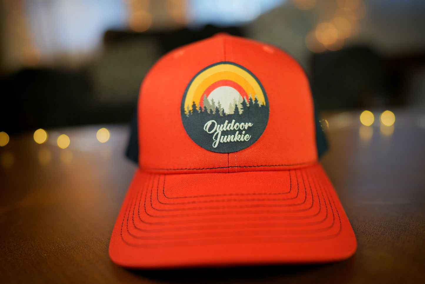"Outdoor Junkie" Design Trucker Hat (Black Mesh/ Orange Fabric)