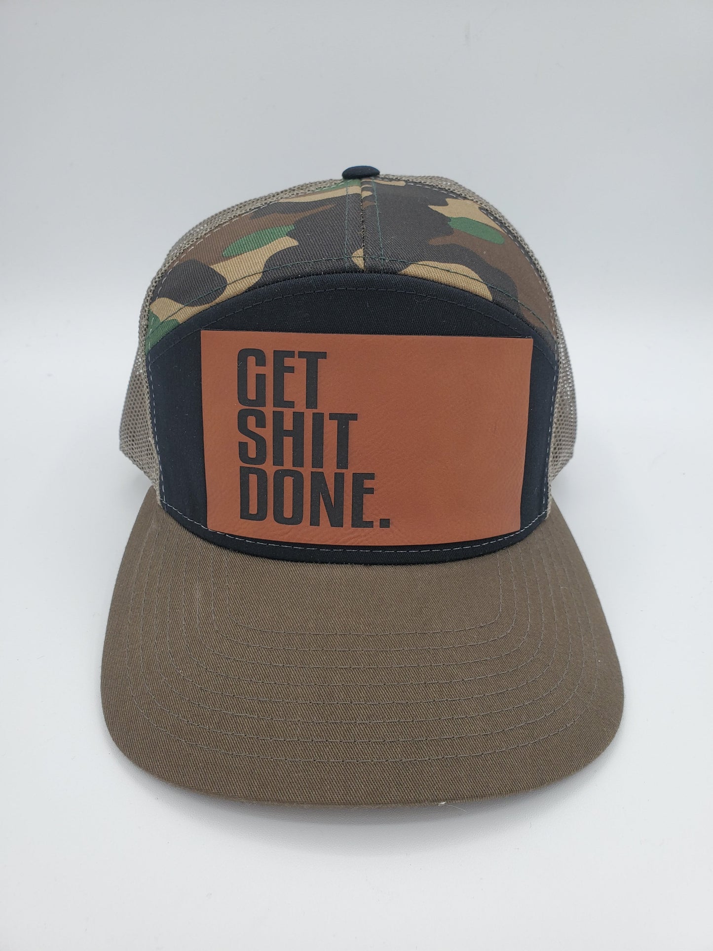 "GET SHIT DONE" 7 Panel Trucker Hat (Black/ Green Camo/ Loden)